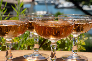 Summer party, French brut rose champagne sparkling wine in coupe glasses in yacht harbour of Port Grimaud near Saint-Tropez, French Riviera vacation, Var, France