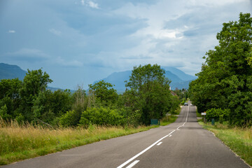 Driving car or camper on free road Route Napoleon in French Alps, touristic road in France