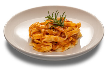 Tagliatelle egg pasta with red tomato sauce and rosemary sprig in white plate isolated