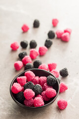 Sweet jelly candies in bowl on kitchen table