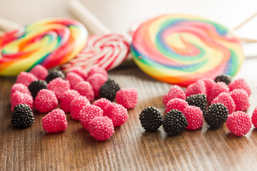 Sweet jelly candies on wooden table.