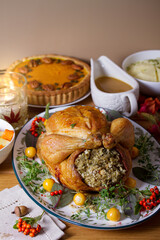 Roast chicken or turkey with sage stuffing, pumpkin pie. Thanksgiving autumn dinner