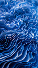 Obraz premium A close-up view of layered blue paper or fabric, showcasing intricate folds and textures. The waves create a dynamic and visually appealing pattern
