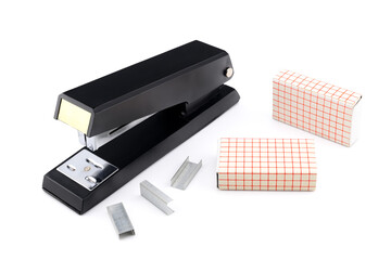 black stapler and steel paper scrapers