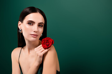 Portrait of gorgeous lady wear seductive look holding red rose empty space isolated green color...