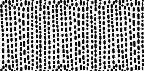 Hand Drawn dash pattern. Seamless pattern with small black lines on a white background