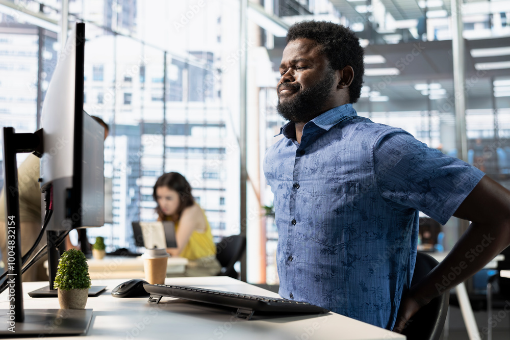 Poster worker suffering backache from incorrect posture, working with machine learning tech advancing ai. t