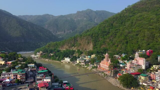 Rishikesh, uttrakhand, India 22 june 2022. Aerial view of the beautiful holy river ganga, lakshman Jhula bridge, and tera manzil temple, trimbakeshwar in rishikesh.