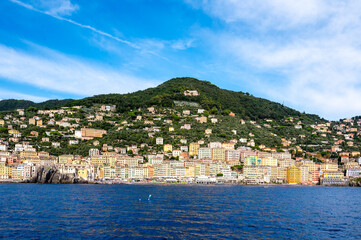Fototapeta premium Colorful buildings and beach at Camogli on sunny summer day, Liguria, Italy