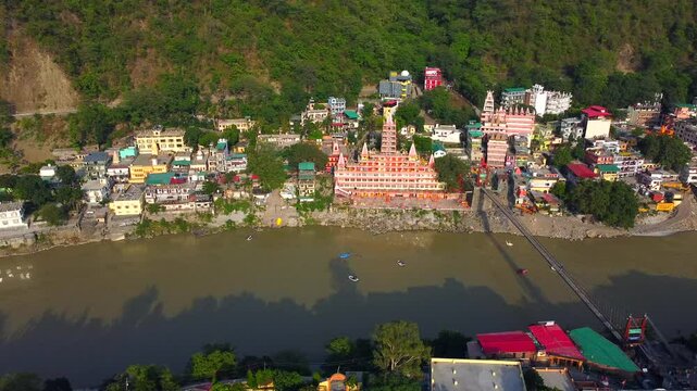 Rishikesh, uttrakhand, India 22 june 2022. Aerial view of the beautiful holy river ganga, lakshman Jhula bridge, and tera manzil temple, trimbakeshwar in rishikesh.