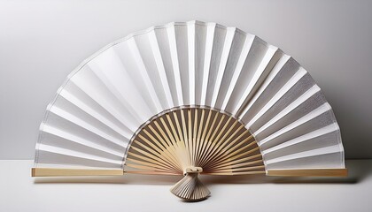 Mockup of a white folding hand fan set apart against a white background