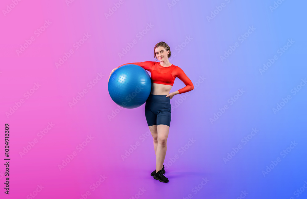 Wall mural full body length gaiety shot athletic and sporty young woman with fitness exercising ball in standin