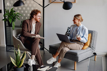 Diverse professionals collaborate in a modern office, showcasing creativity and boosting...