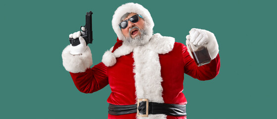 Bad Santa Claus with gun and drink on green background