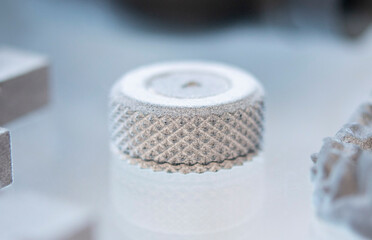 Objects printed on a 3D printer from molten plastic powder. Different models printed on 3D printer from melted grey polyamide powder. New additive 3D printing Multi Jet Fusion MJF technology