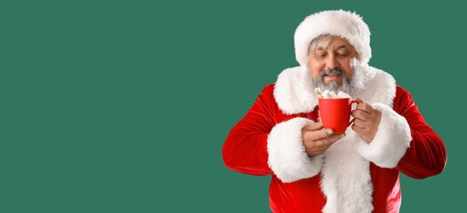 Santa Claus drinking hot chocolate on green background with space for text