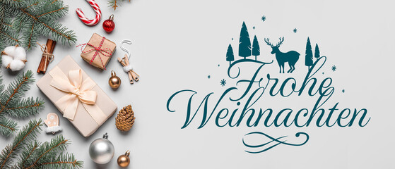 Composition with Christmas gifts, decorations and fir branches on grey background