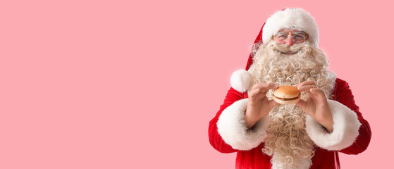 Santa Claus with tasty burger on pink background