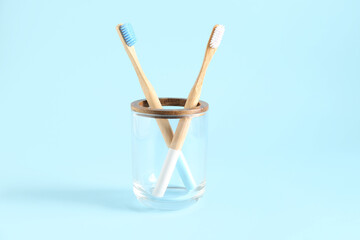 Toothbrush cup holder on blue background