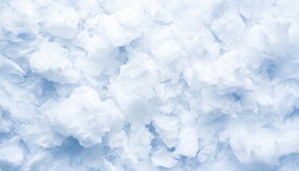 Close-up of snowflakes on a light blue background, showcasing winter beauty.