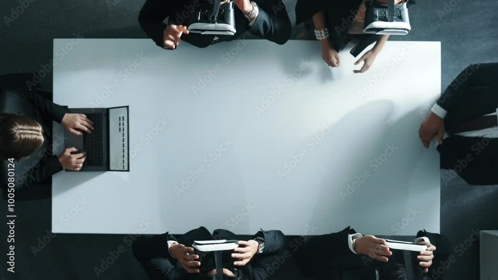 Poster top down aerial view of diverse data analysts wearing vr headset and stand around table while using 