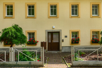 View of beautiful building with door and flowers