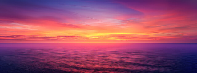 Fototapeta premium Stunning sunset over calm waters, featuring vibrant hues of orange, pink, and purple, creating a serene and tranquil atmosphere.