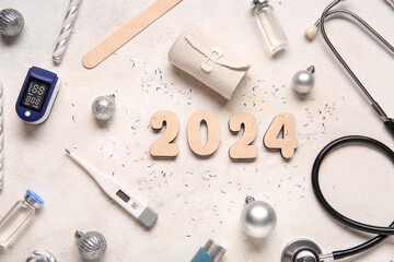 Figure 2024 and doctor's tools with Christmas decor on white background