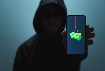Suspicious Man with Phone Representing SMS Phishing Scam (Smishing)