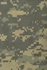 Universal camouflage pattern army combat uniform digital camo, natural vertical USA military ACU ripstop fabric background macro closeup, foliage green, desert sand tan, urban taupe grey NYCO swatch