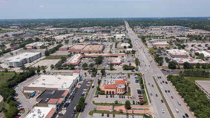 Overland Park, Kansas, USA - June 17, 2023: Morning traffic passes through the downtown commercial district of Overland Park.