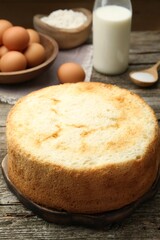 Tasty fresh sponge cake on wooden table