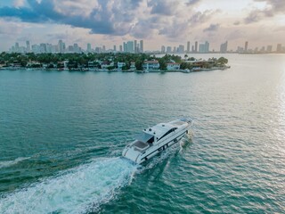 Jet boat in the Biscayne Bay harbour going past the Venetian Islands, Miami, Florida, United States.