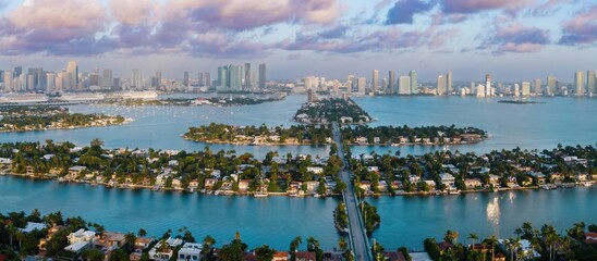 The Venetian islands at sunrise in the Biscayne Bay wih a view to downtown Miami, Florida, United...