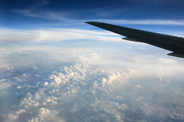 Fototapeta premium airplane wing and cloud during the flight