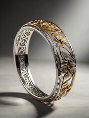 A bracelet features intricate gold and silver designs.