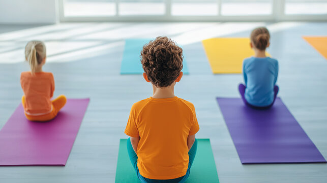 Children practicing yoga on colorful mats indoors, promoting mindfulness and well-being - Powered by Adobe