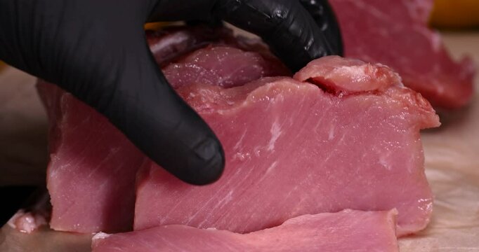 a cut piece of pork fillet on a cutting board, sliced high-quality pork meat without bones