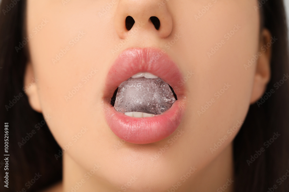 Canvas Prints Beautiful young woman with ice cube in her mouth, closeup