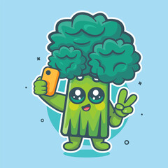 happy broccoli vegetable character mascot taking a selfie with a smartphone isolated cartoon