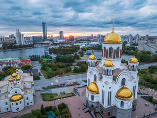 Summer Yekaterinburg, Temple on Blood and Church of St Nicholas in sunset. Aerial view of Yekaterinburg, Russia. Translation of text on the temple: Honest to the Lord is the death of His saints