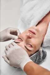 Relaxing facial treatment at a spa with a client receiving care