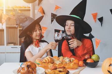friendship, holiday and people concept - group of happy smiling friends in halloween costumes of...