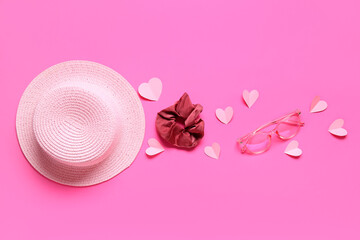 Hat with eyeglasses, hair accessory and hearts on pink background. Valentine's Day celebration