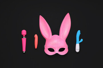 Pink bunny mask with vibrators on black background
