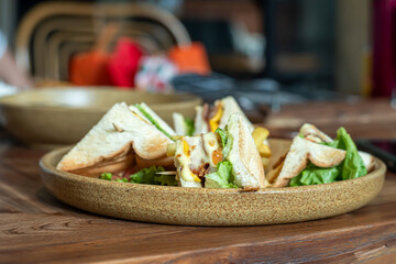 a plate of sandwiches placed on the table, ready to eat