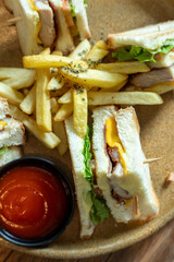 a plate of sandwiches placed on the table, ready to eat