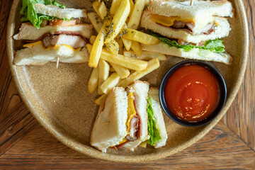 a plate of sandwiches placed on the table, ready to eat