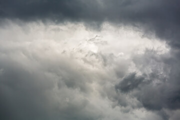 dark dramatic sky with overcast grey clouds before thunderstorm.