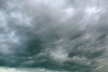 Obraz premium dramatic dark overcast sky with rainy clouds before thunder-storm.